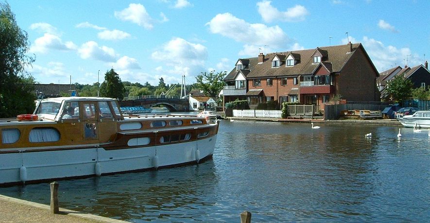 Anchor & Riverside Cottages (white fences) situated close to the centre of Wroxham, 'Capital of the Norfolk Broads'
